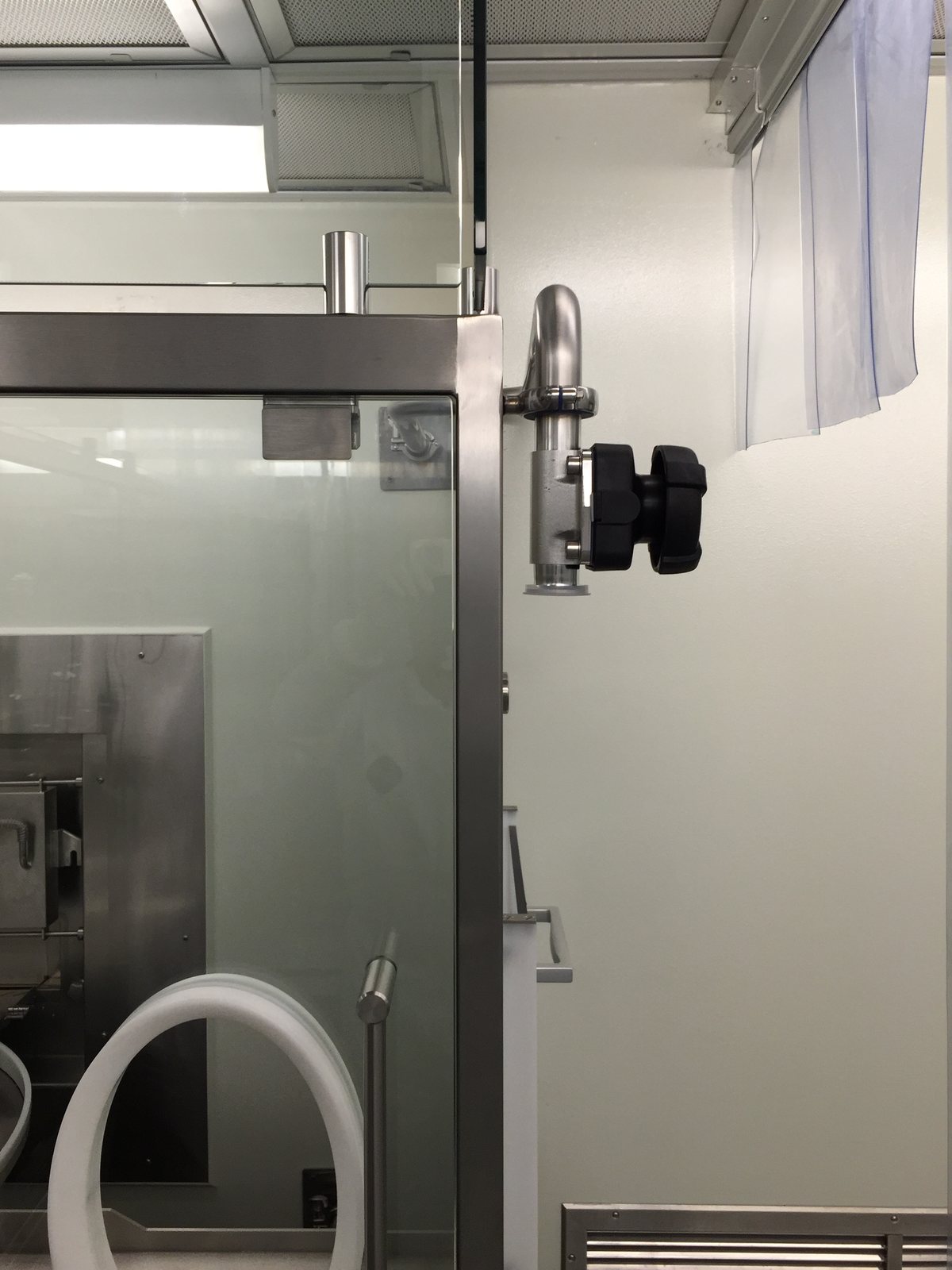 Sanitary process piping routed through a clean-room wall